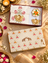 Diwali Home Décor Gift Box with 2 Cushion Covers, 1Handmade Floral Soy Wax Candle & 2 Metal Diyas