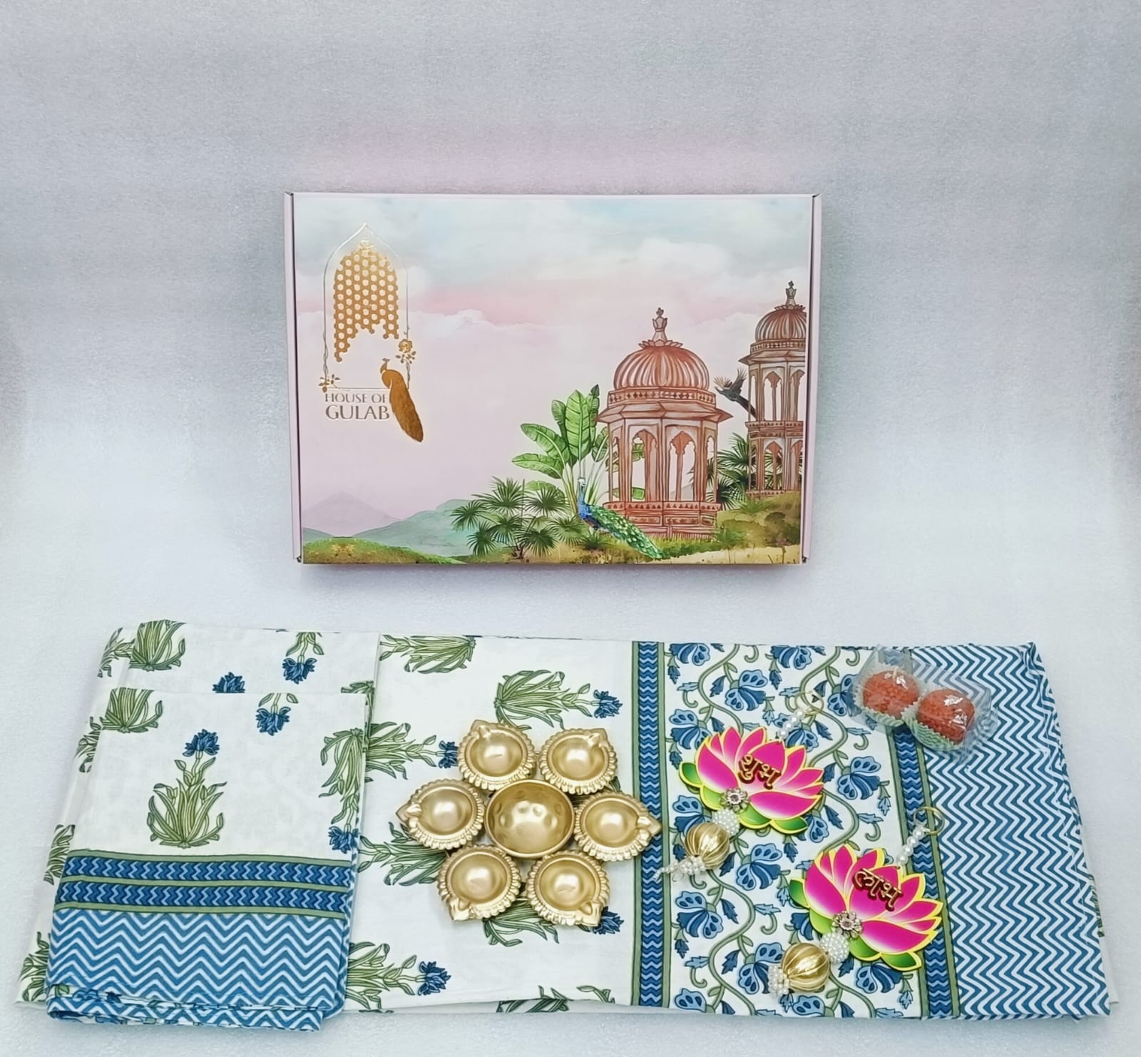Diwali Gift Box | 1 Double Bedsheet, 1 Pair Door Hanging, 1 Metal Urli, 2 Laddoo Candles