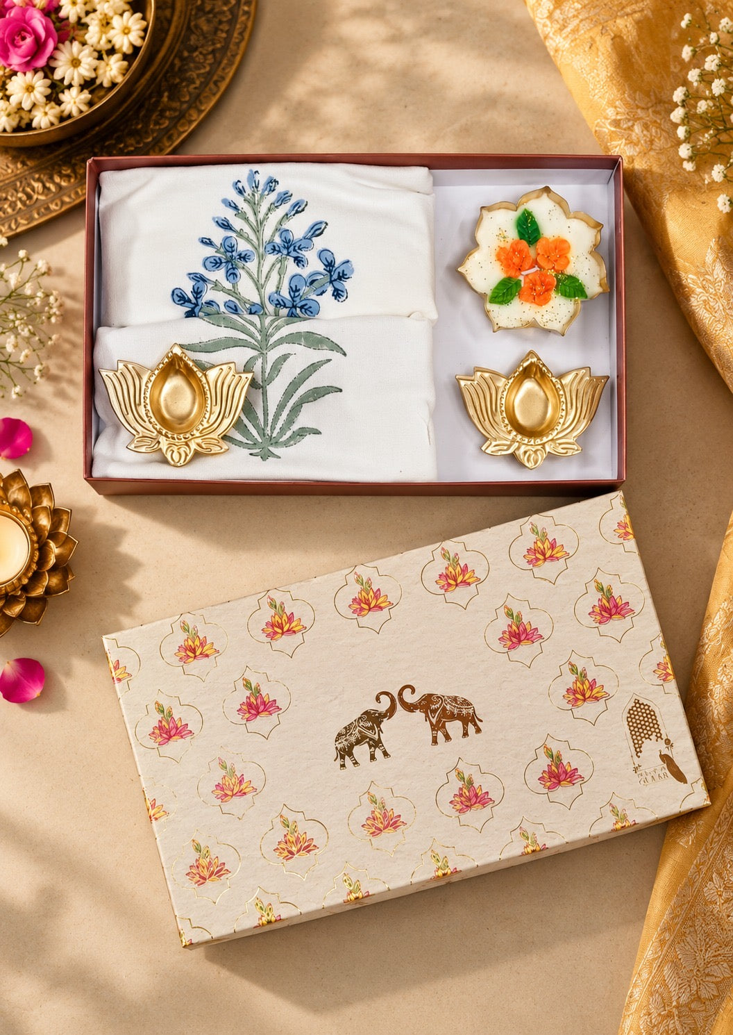 Diwali Home Décor Gift Box with 2 Cushion Covers, 1Handmade Floral Soy Wax Candle & 2 Metal Diyas