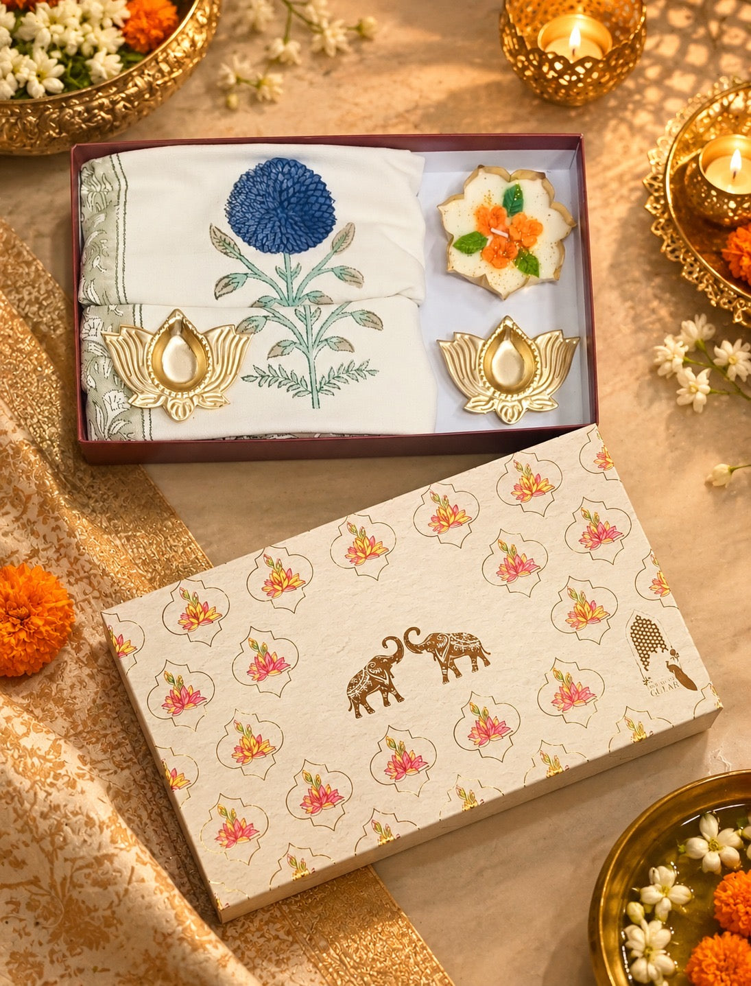 Diwali Home Décor Gift Box with 2 Cushion Covers, 1Handmade Floral Soy Wax Candle & 2 Metal Diyas