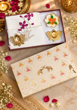 Diwali Home Décor Gift Box with 2 Cushion Covers, 1Handmade Floral Soy Wax Candle & 2 Metal Diyas