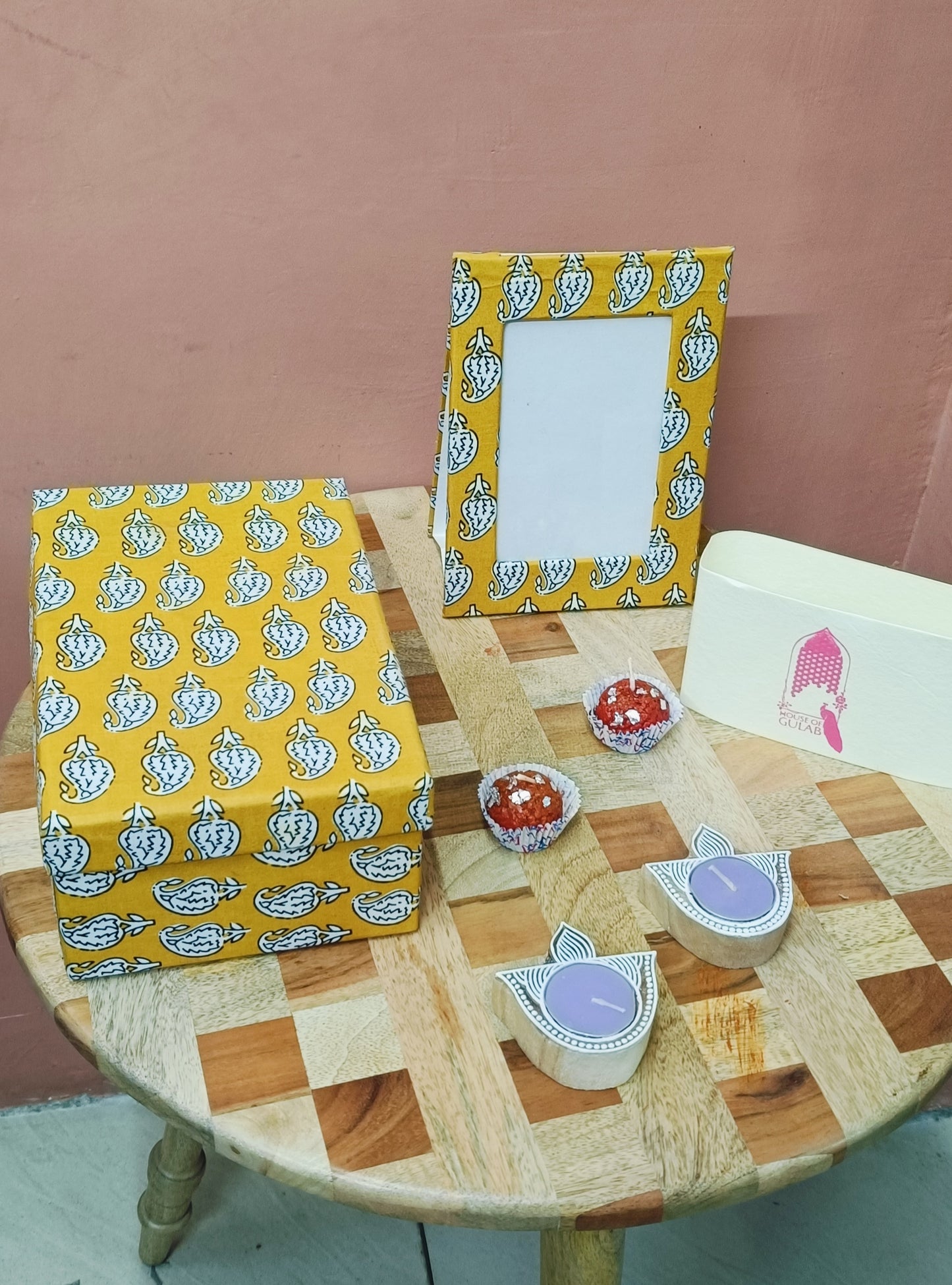 Gift Box with Work Desk Essential : 1 Diary, 1 Notepad, 1 Photoframe, 2 laddoo candles, 2 handblock candles