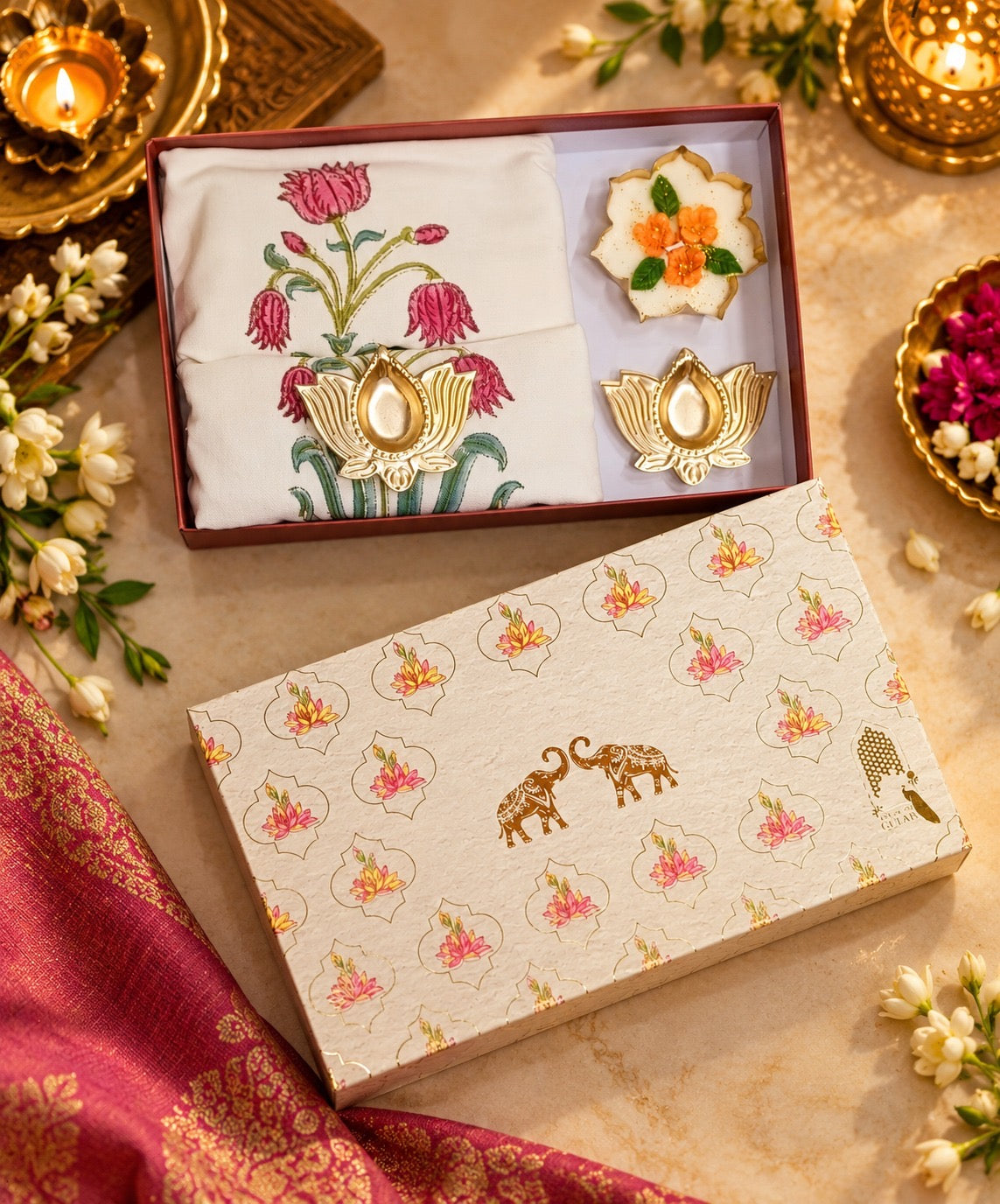 Diwali Home Décor Gift Box with 2 Cushion Covers, 1Handmade Floral Soy Wax Candle & 2 Metal Diyas
