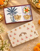 Diwali Home Décor Gift Box with 2 Cushion Covers, 1Handmade Floral Soy Wax Candle & 2 Metal Diyas