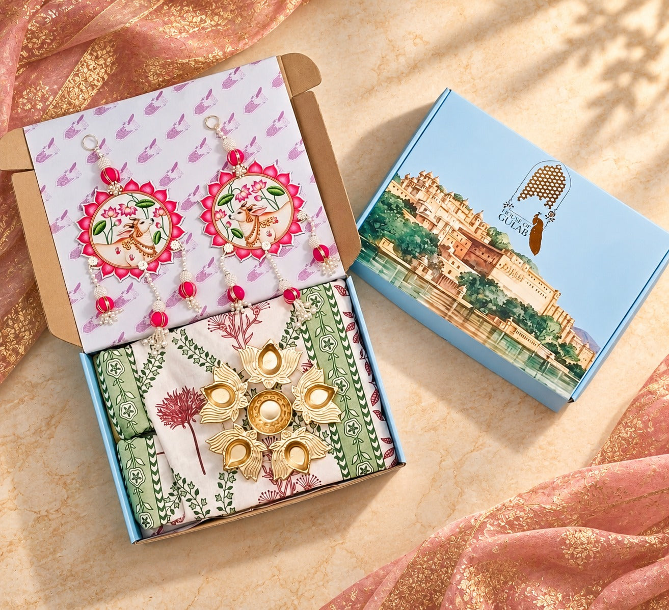 Diwali Complete Gift Box | 1 Ethnic Motifs Double Bedsheet with 2 Pillow Covers, 1 Lotus Urli, Set of 2 Door Hangings