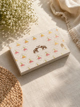 Diwali Home Décor Gift Box with 2 Cushion Covers, 1Handmade Floral Soy Wax Candle & 2 Metal Diyas